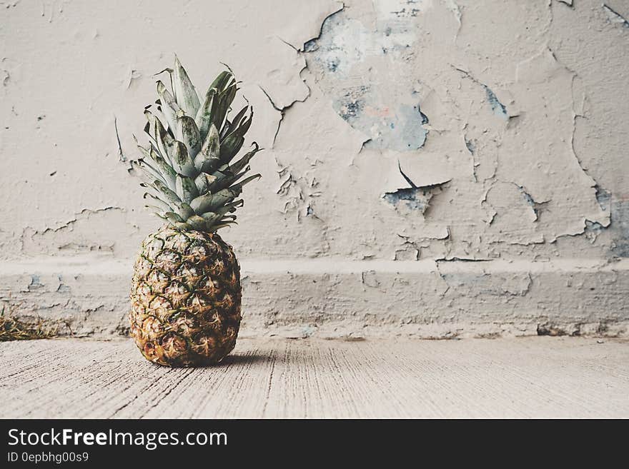 Pineapple Beside Concrete Wall