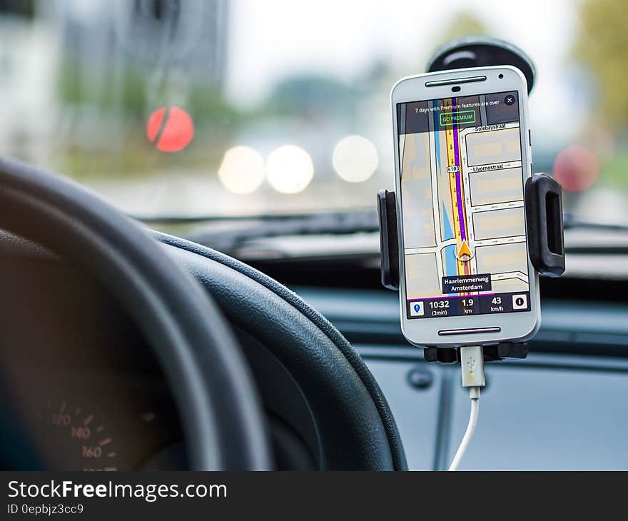 The interior of a car with a smartphone used for navigation. The interior of a car with a smartphone used for navigation.