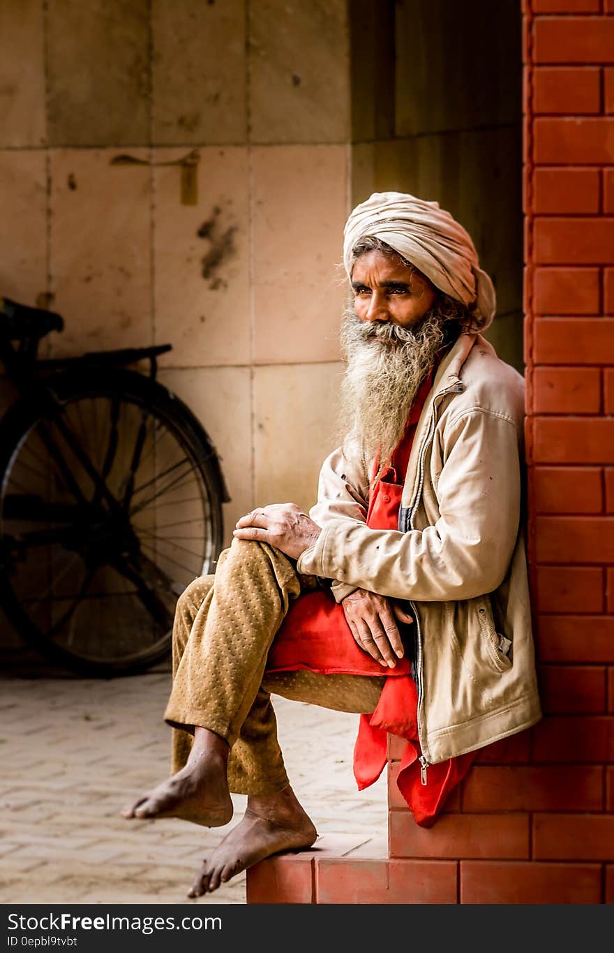 Man in White Kafiyeh Sitting