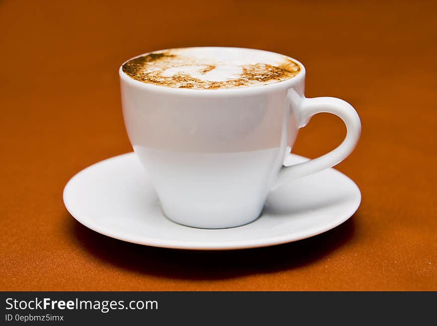 White Ceramic Cup on White Ceramic Saucer