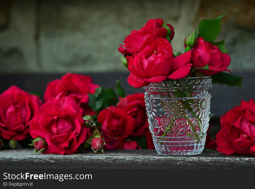 3 Red Rose on Glass Container