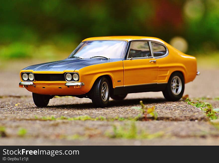 Yellow and Black Muscle Car in Tilt Shift Photography