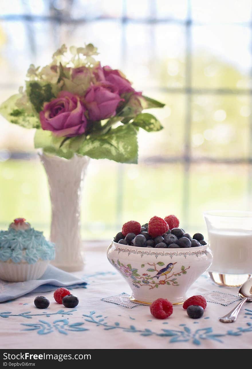 Pink Flowers Near Fruit Bowl