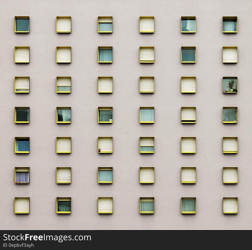 Geometric pattern from windows on exterior building wall. Geometric pattern from windows on exterior building wall.