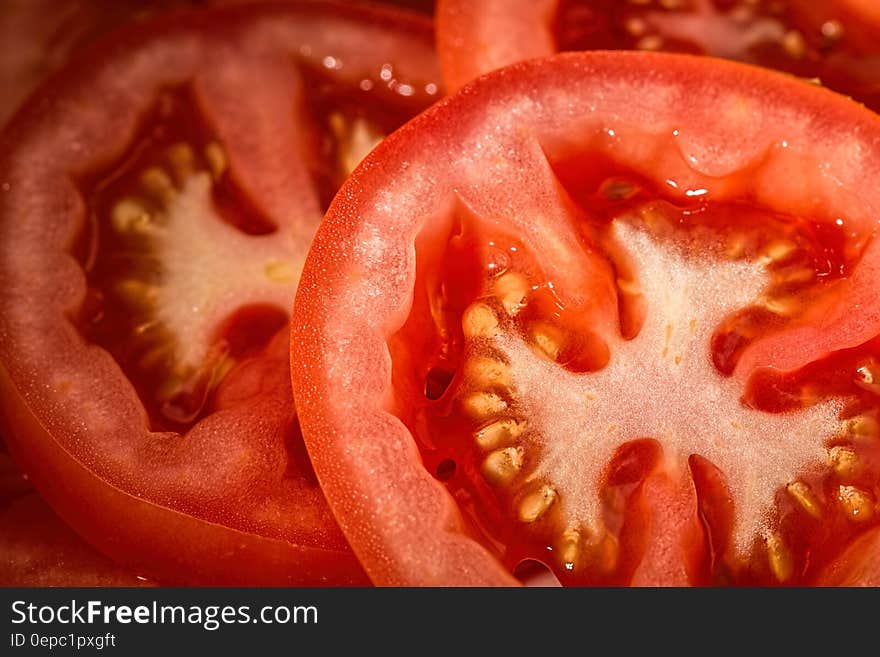 Closeup of slices of fresh red tomatoes.