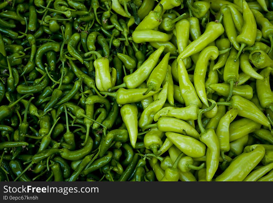 Green textured background created by Anaheim (mild) and Serrano (hot) peppers,. Green textured background created by Anaheim (mild) and Serrano (hot) peppers,