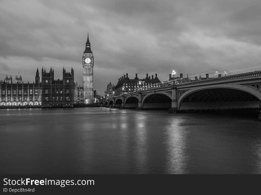 A black and white view of river Thames in London with the Westminster bridge and Westminster palace. A black and white view of river Thames in London with the Westminster bridge and Westminster palace.