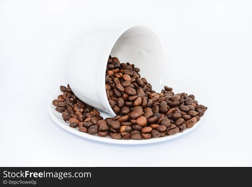 Coffee Beans on White Ceramic Saucer