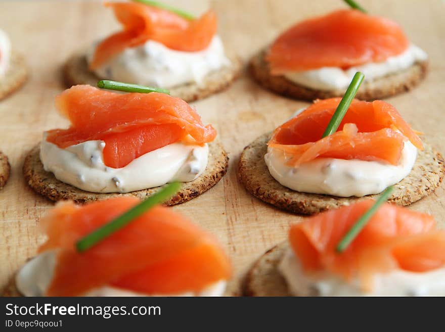 Brown White and Orange Round Food on Table Top