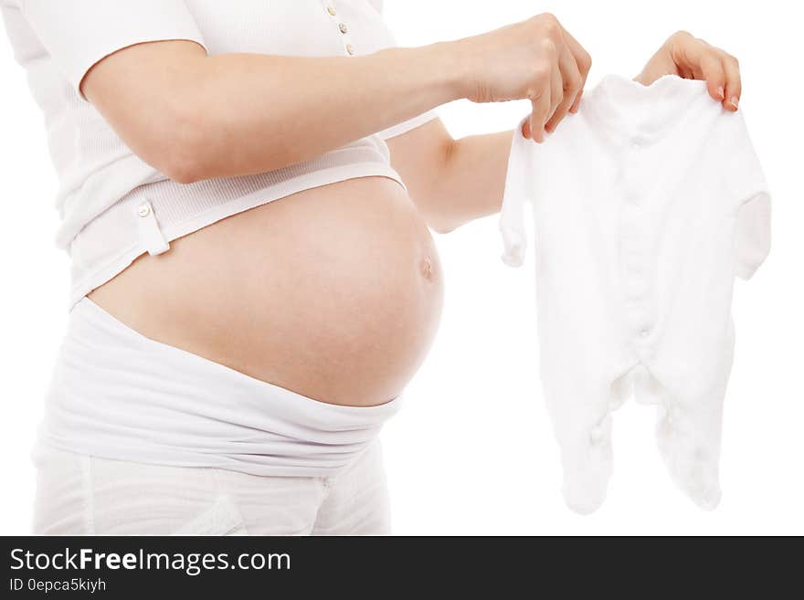 Pregnant Woman in White T Shirt and Shorts