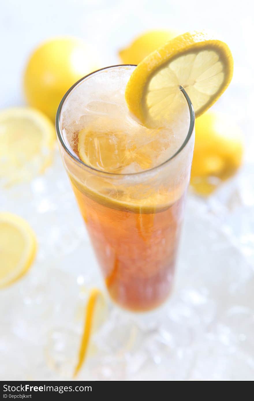 Cold Drinks Served on Clear Highball Glass With Lemon Garnish