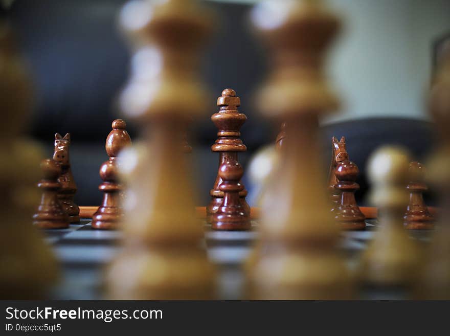 Game of chess in progress viewed at board level looking between two pieces to king.