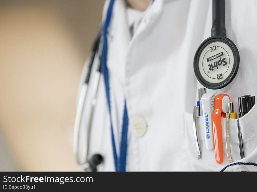 Macro Photo of Stethoscope and Pens