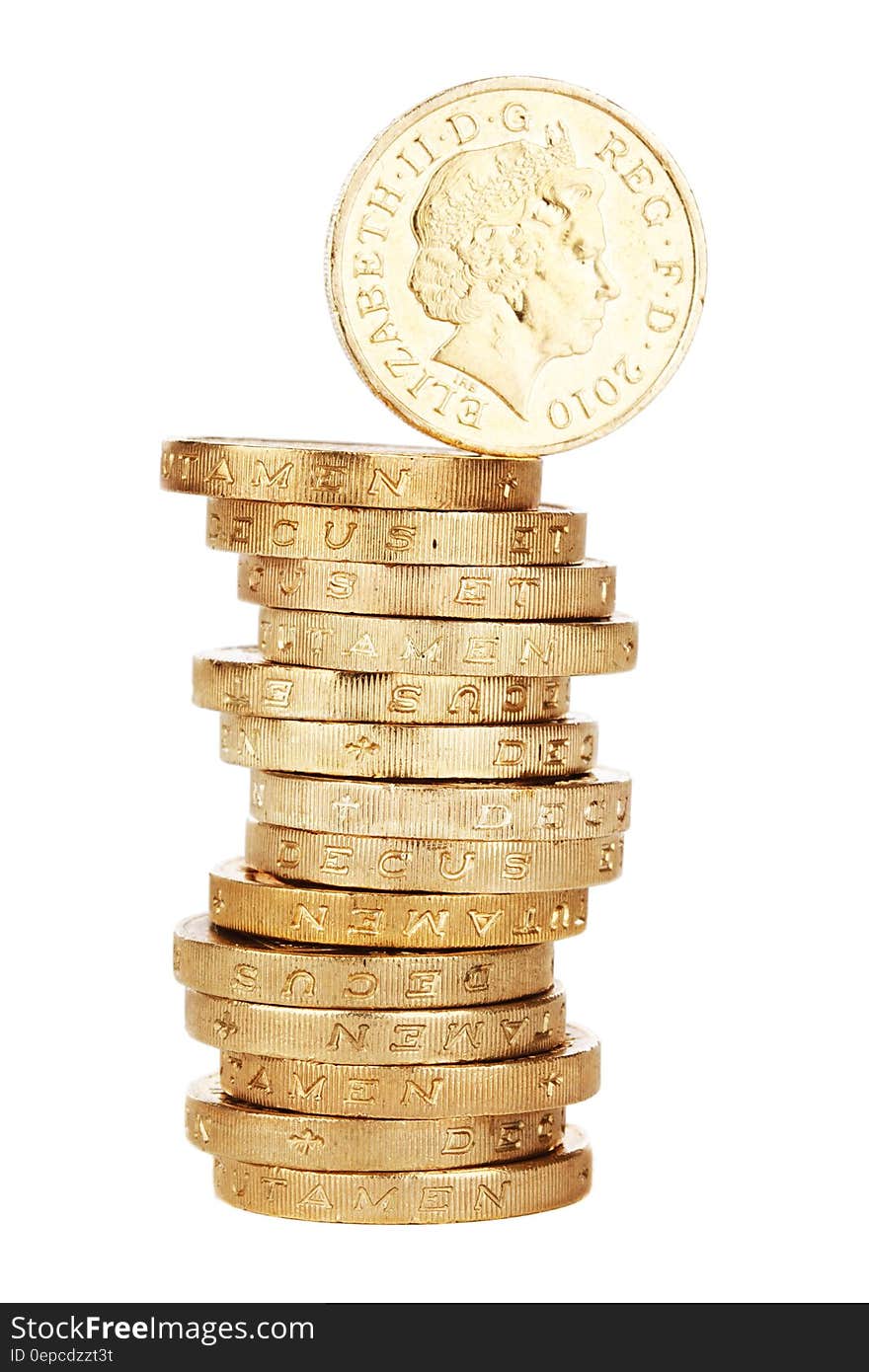 Tall stack of British one pound coins viewed from side with one balancing on top, white background.