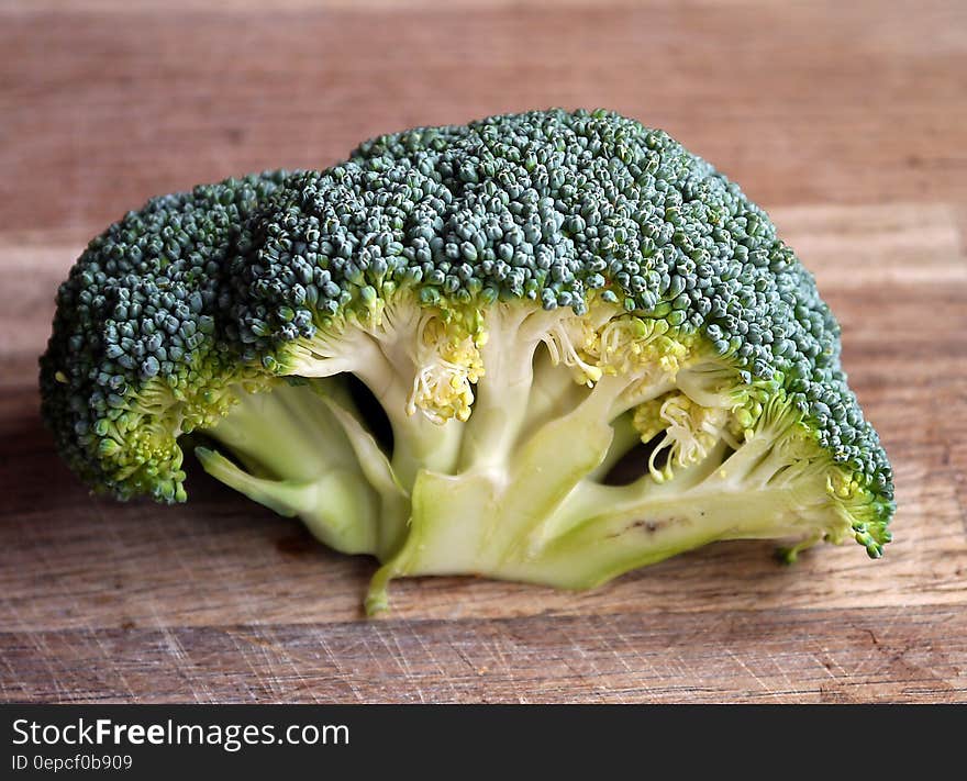 Green Broccoli Vegetable on Brown Wooden Table