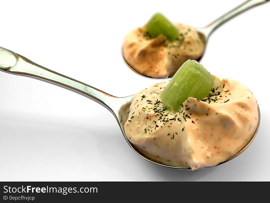 Kiwi Slice on Brown Cream on Stainless Steel Spoon