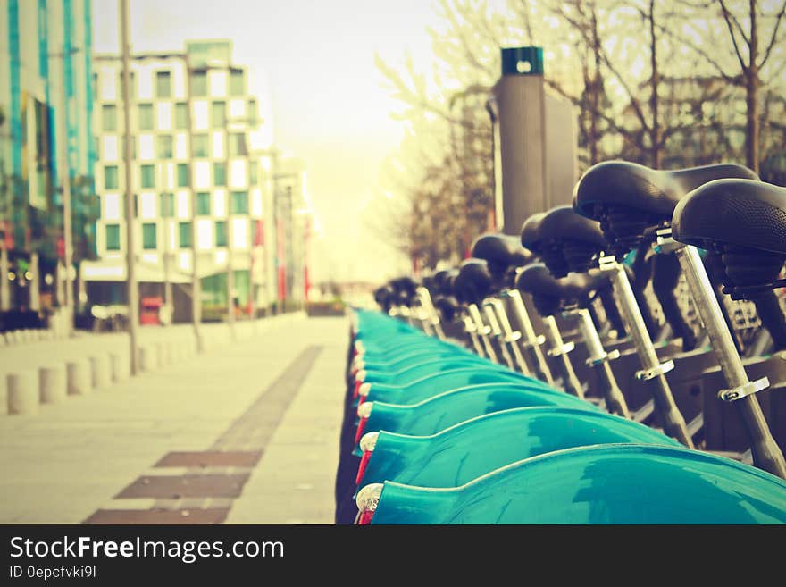 Fenders of bicycles parked on sidewalk of Dublin, Ireland on sunny day. Fenders of bicycles parked on sidewalk of Dublin, Ireland on sunny day.