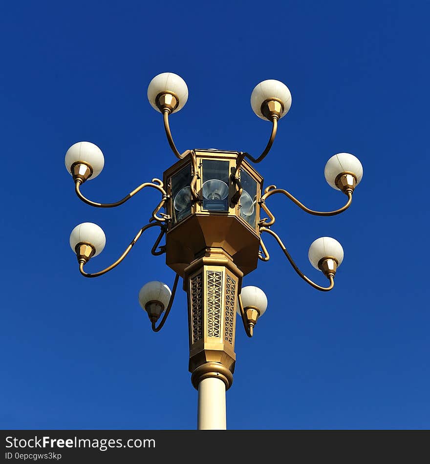 Brown Metal Street Lamp Under Clear Blue Sky during Daytime