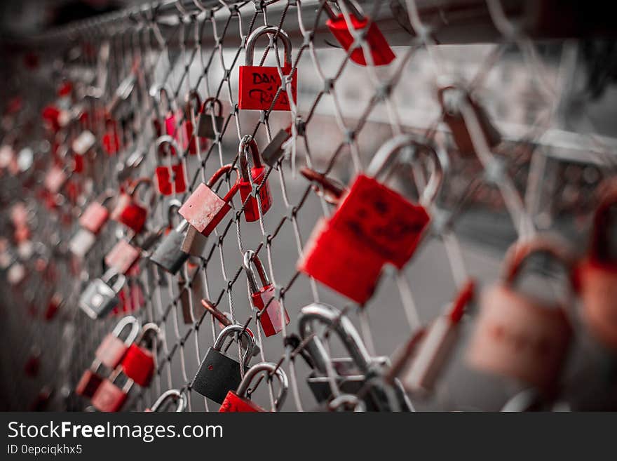 Red Padlock on Cyclone Fence