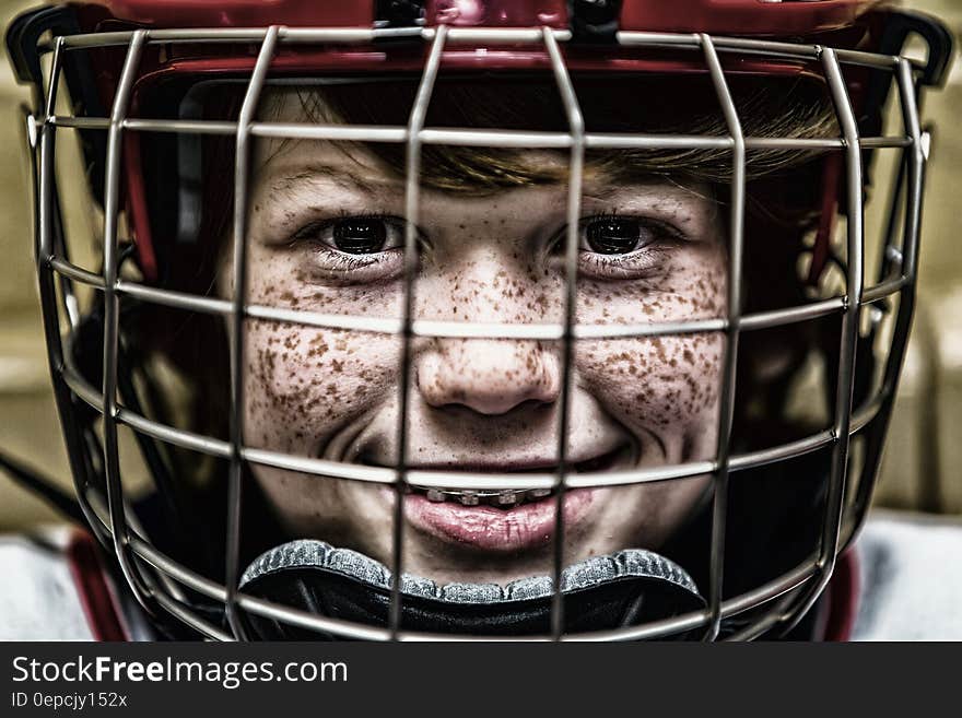 Boy With a Football Helmet Smiling