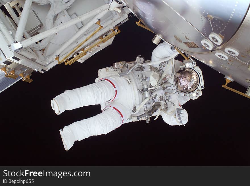 Person in White Astronaut Suit