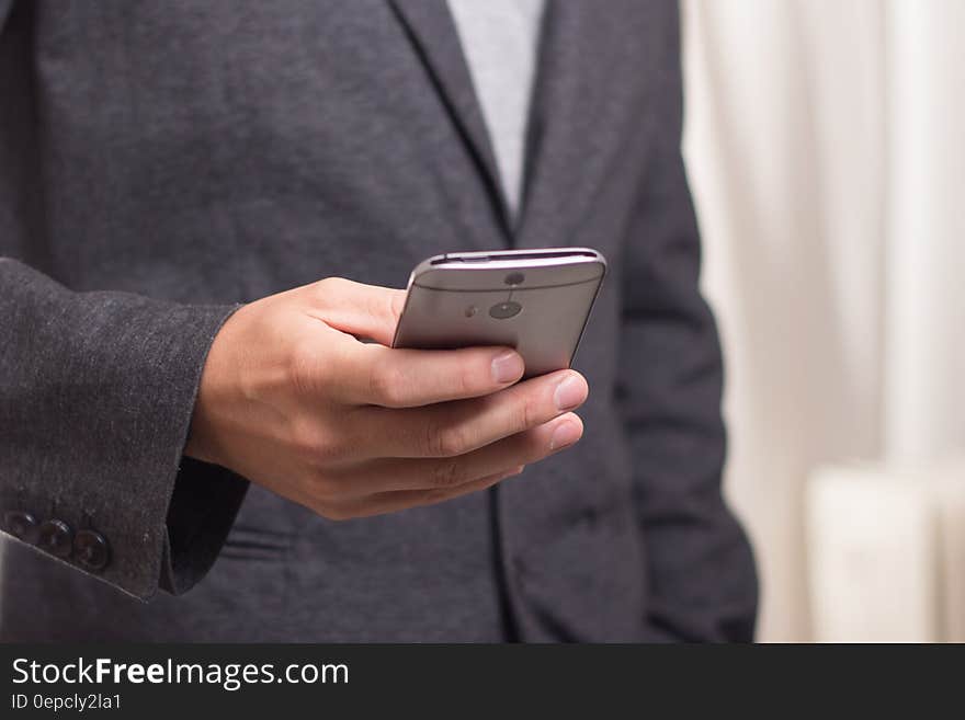 Person Holding Grey Smartphone