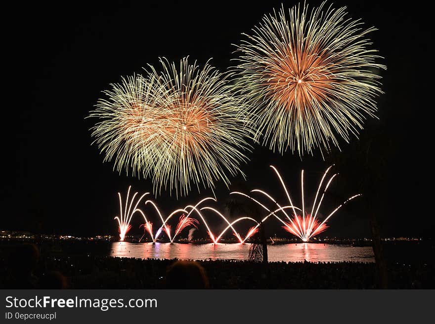 Yellow Orange and Red Fireworks during Nighttime