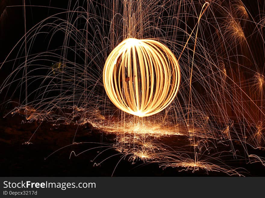 White light painting with orange sparks at night. White light painting with orange sparks at night.