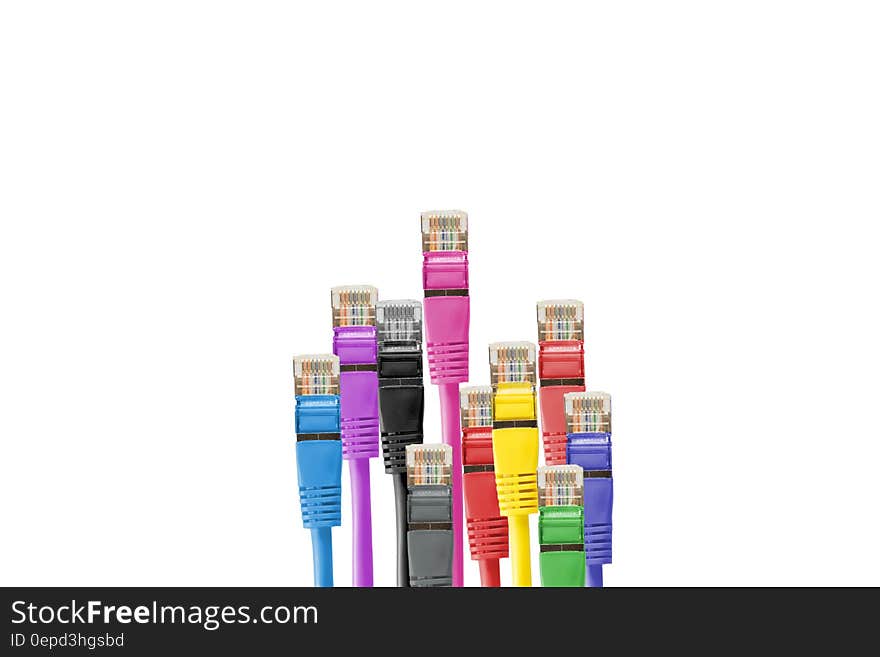 Colorful cables with network plastic plugs isolated on white with copy space. Colorful cables with network plastic plugs isolated on white with copy space.