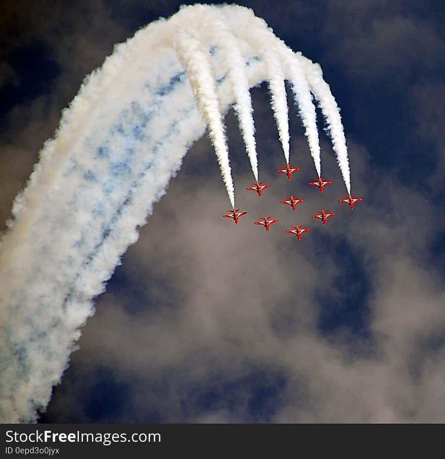 Red Acrobat Planes Flying During Daytime