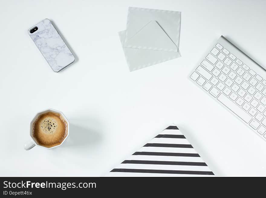 Apple Magic Keyboard Besides White Letter Envelope