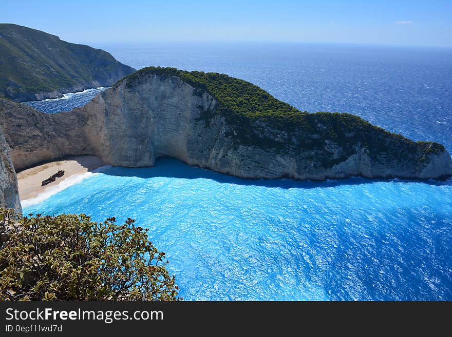 Green Island Near the Ocean during Daytime