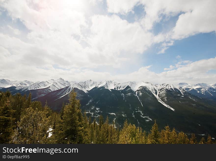 Mountain Under White Clouds during Daytime