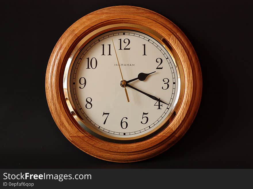 Brown Wooden Framed Clock Showing 2:19