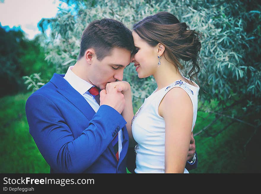 Man Kissing Woman&#x27;s Right Hand