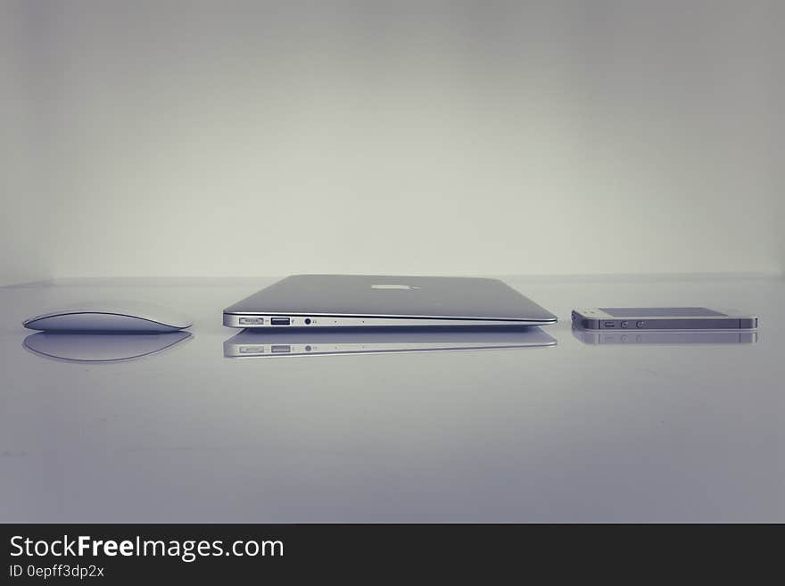 Silver Magic Mouse Beside Macbook