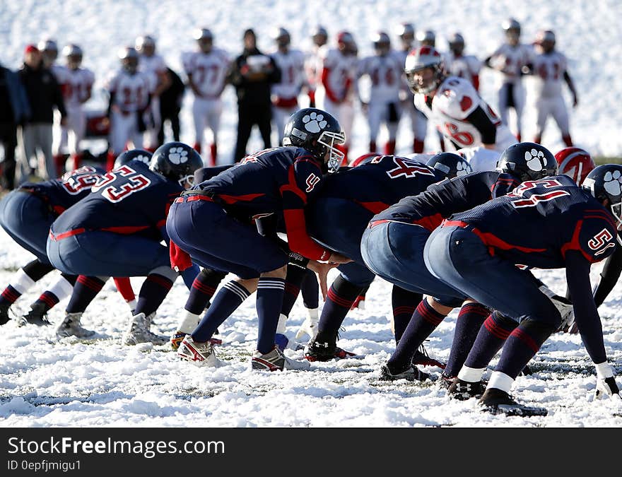 Football Team on Ice during Daytime