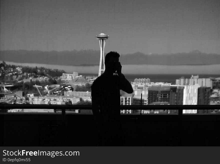 Silhouette of Man Near Handrails