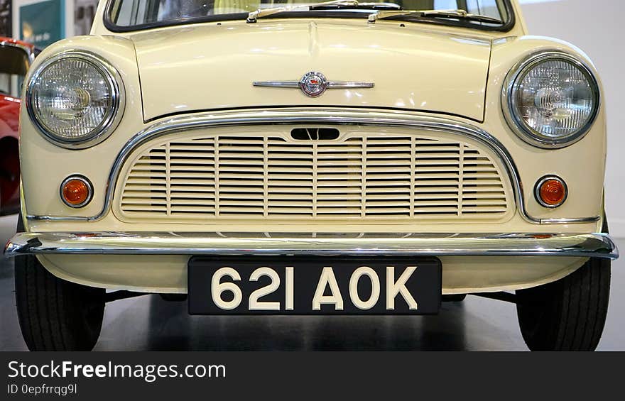 Yellow Classic Car With 621 Aok Licensed Plate