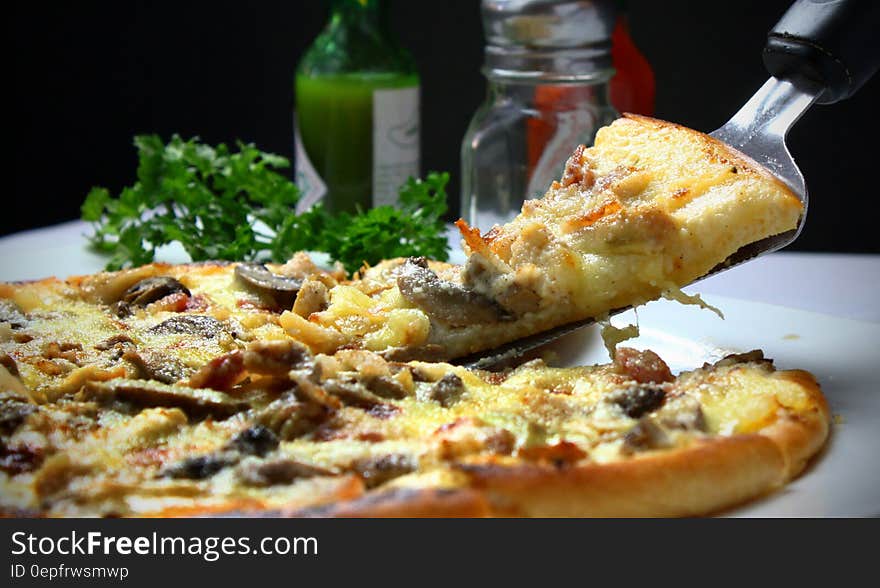 Close up of pizza pie with mushrooms.