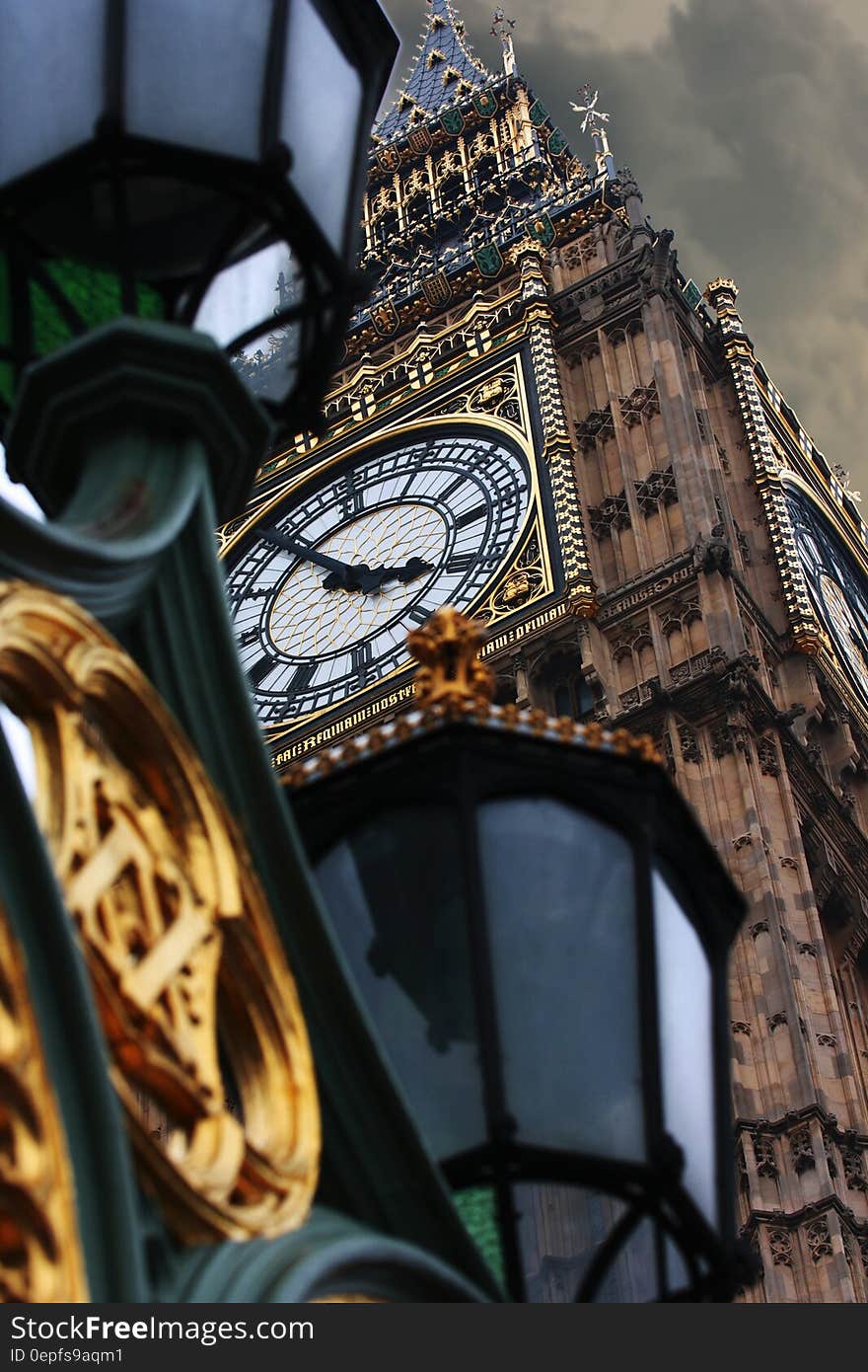 Close up of Big Ben clock tower and streetlamp in London, England. Close up of Big Ben clock tower and streetlamp in London, England.