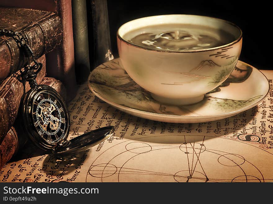 White Ceramic Cup on White Ceramic Plate