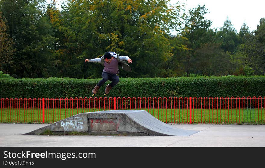 Man Jumping on Rollerskates Ramp