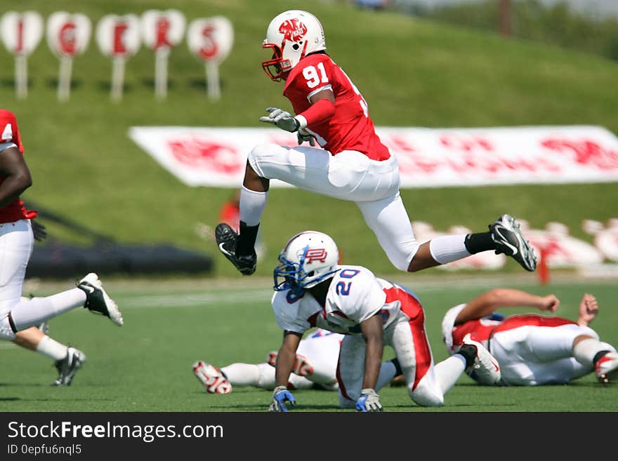 Football Player Pass by over Reaching the Goal