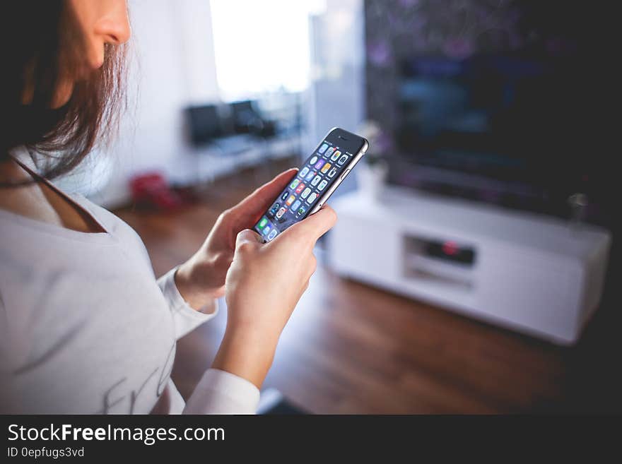 Woman Wearing White V Neck Shirt Using Space Gray Iphone 6