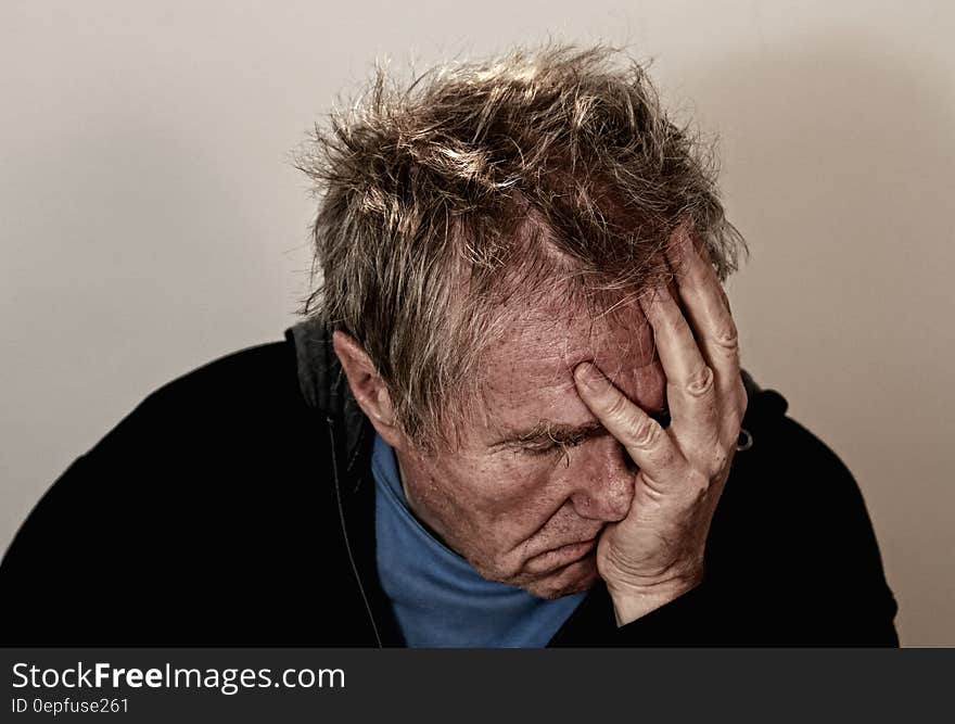 Studio portrait of depressed sad man. Studio portrait of depressed sad man.