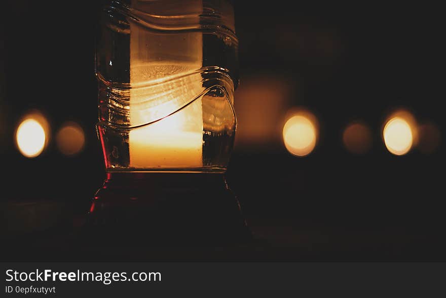 Pillar Candle Inside Glass Bottle