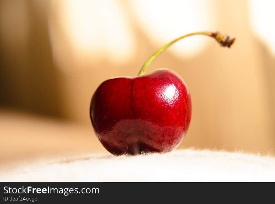 A close up of a red cherry. A close up of a red cherry.