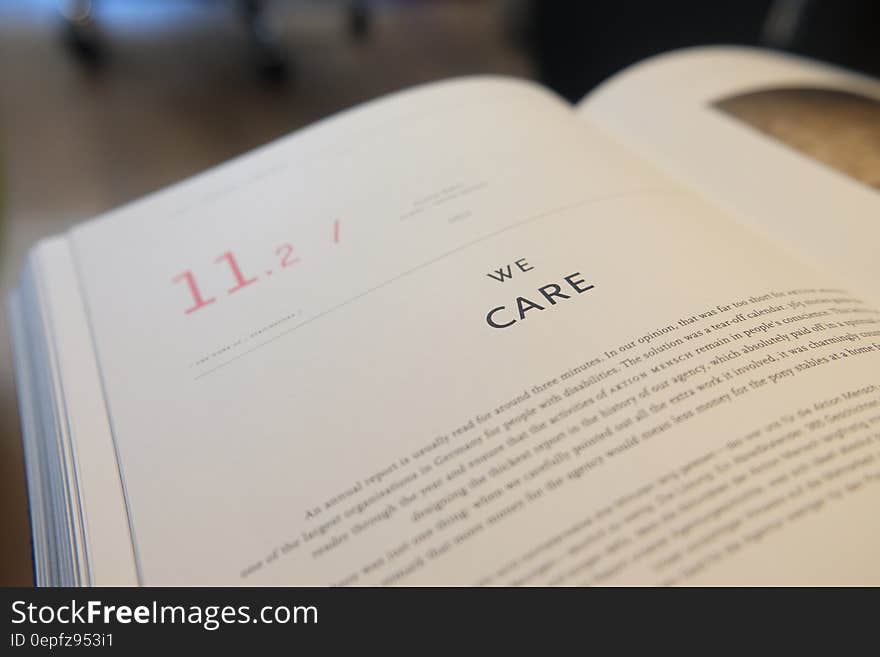 An open book with the text "we care".