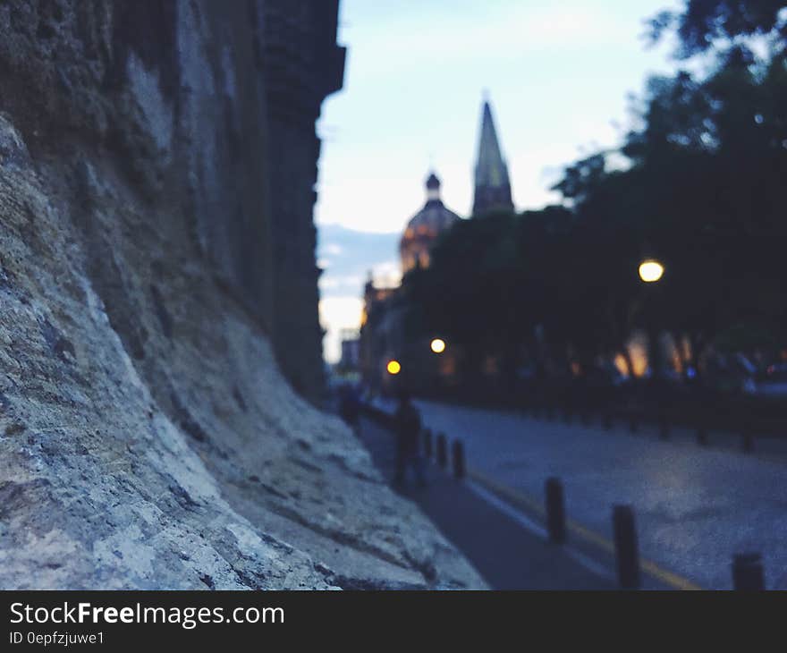 Close up of stone wall in town at twilight.